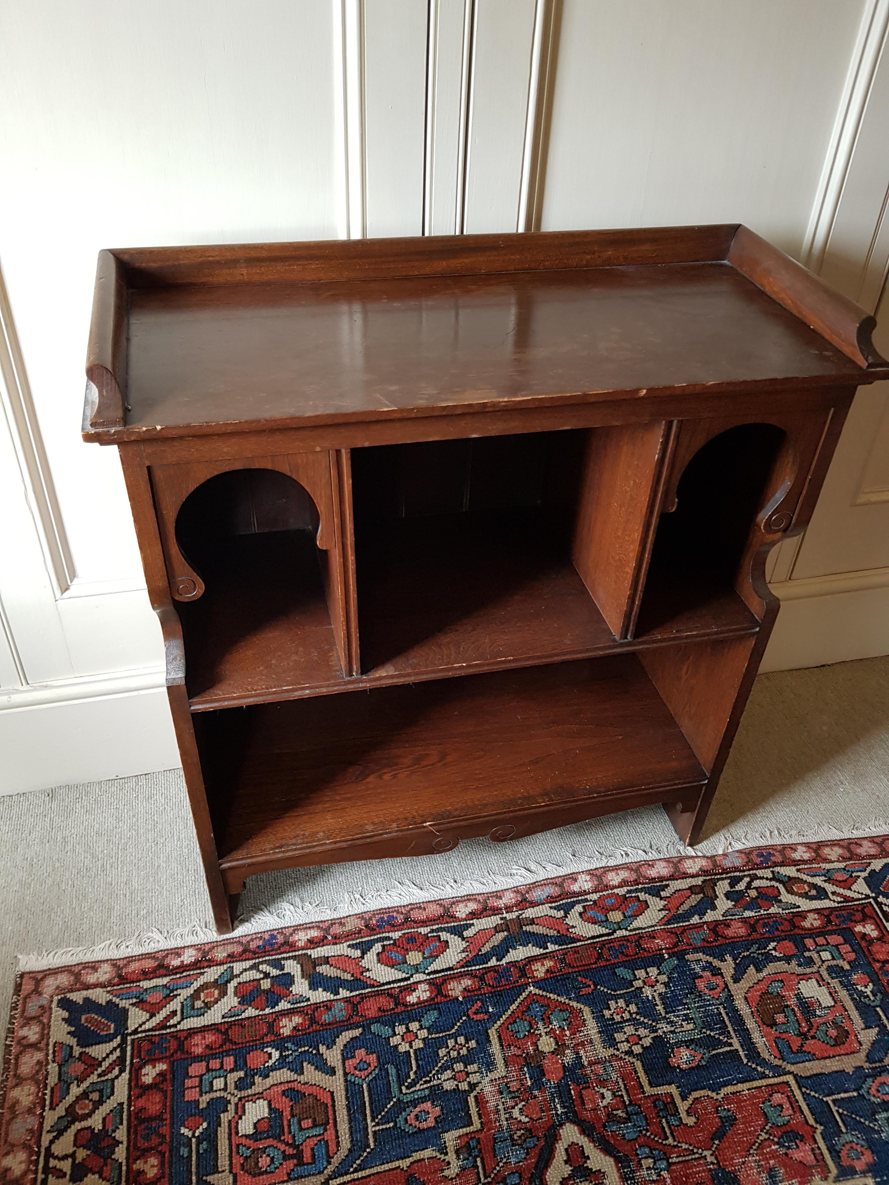 An early 20th century Moorish style Blackie & Son Limited oak open bookcase, width 77cm, depth 33cm, height 85cm